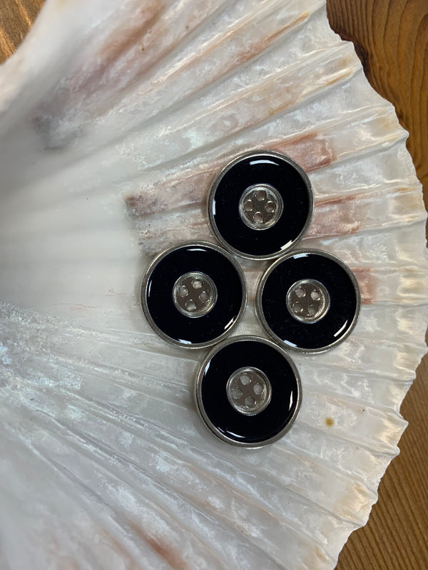 Silver and Black Metal Buttons